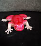 Handmade epoxy resin frog ornament. Pale pink and cerise shimmer