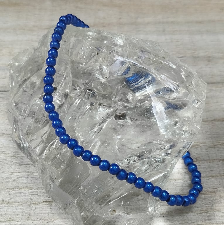 AL95a  Blue miracle bead elasticated anklet 9.5"
