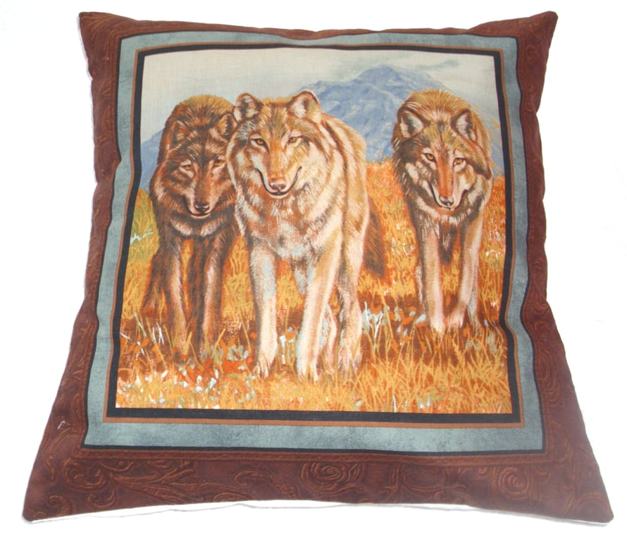 wolves walking forward in an autumnal meadow cushion