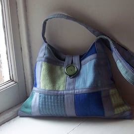 Soft textile shoulder bag in grey, blue and soft green