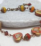 Rustic heart bracelet in red and dark yellow tones - Image 7