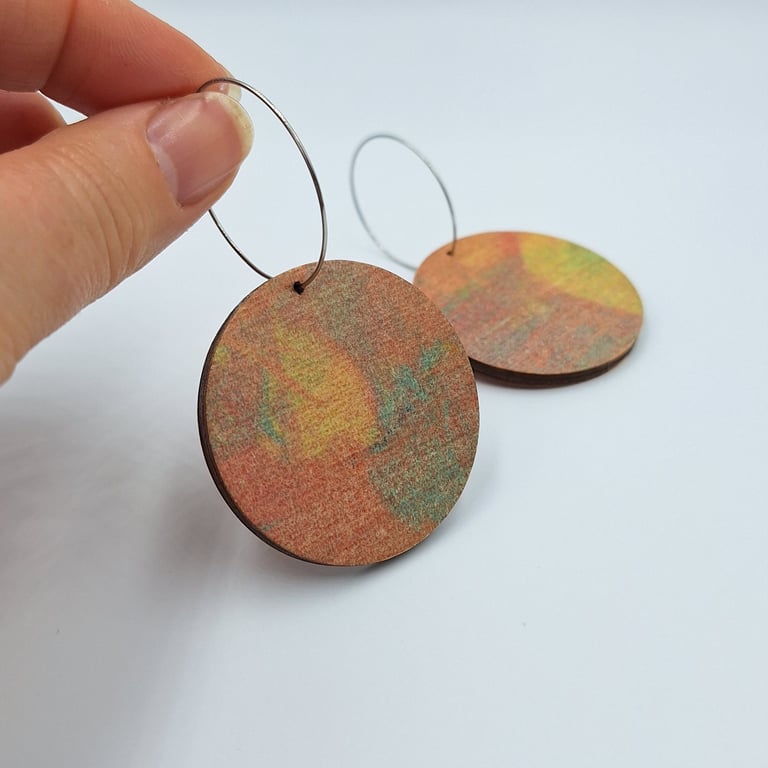Big hooped dangly earrings with a delicate painted effect print