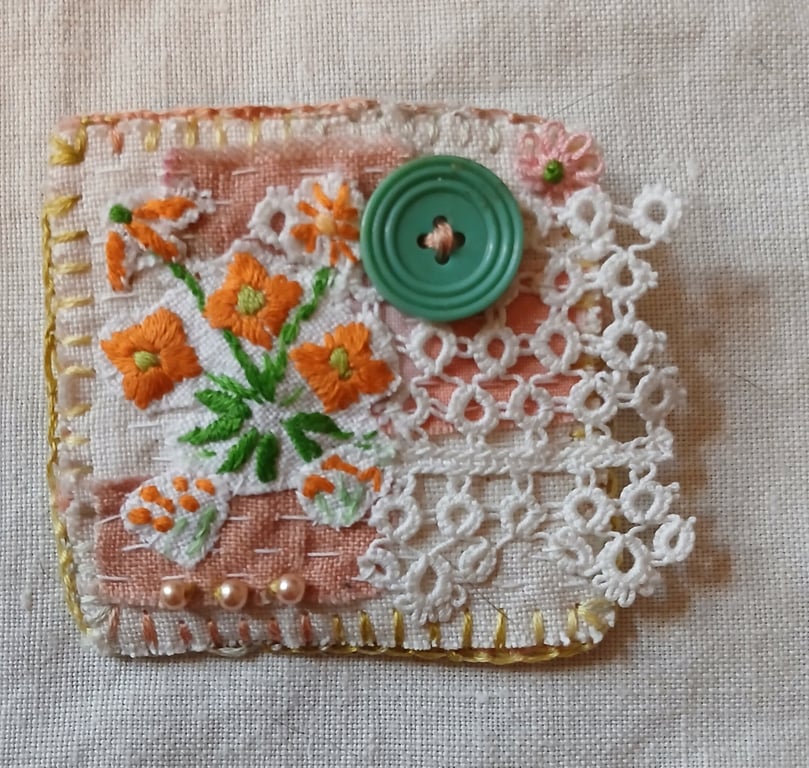 Orange flower textile brooch