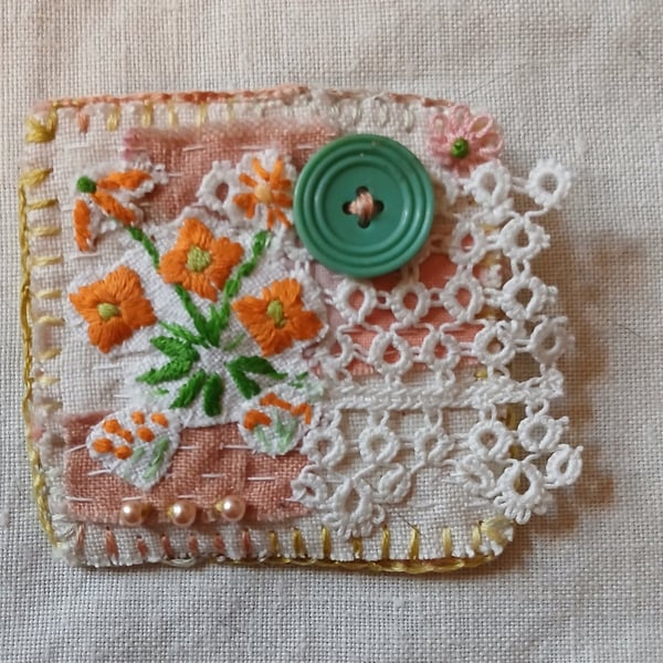 Orange flower textile brooch