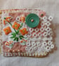 Orange flower textile brooch