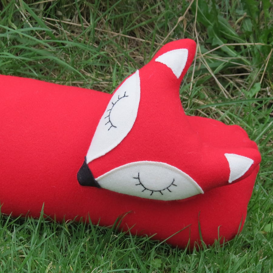 Long fox.  A red fox draught excluder, made from tactile wool.