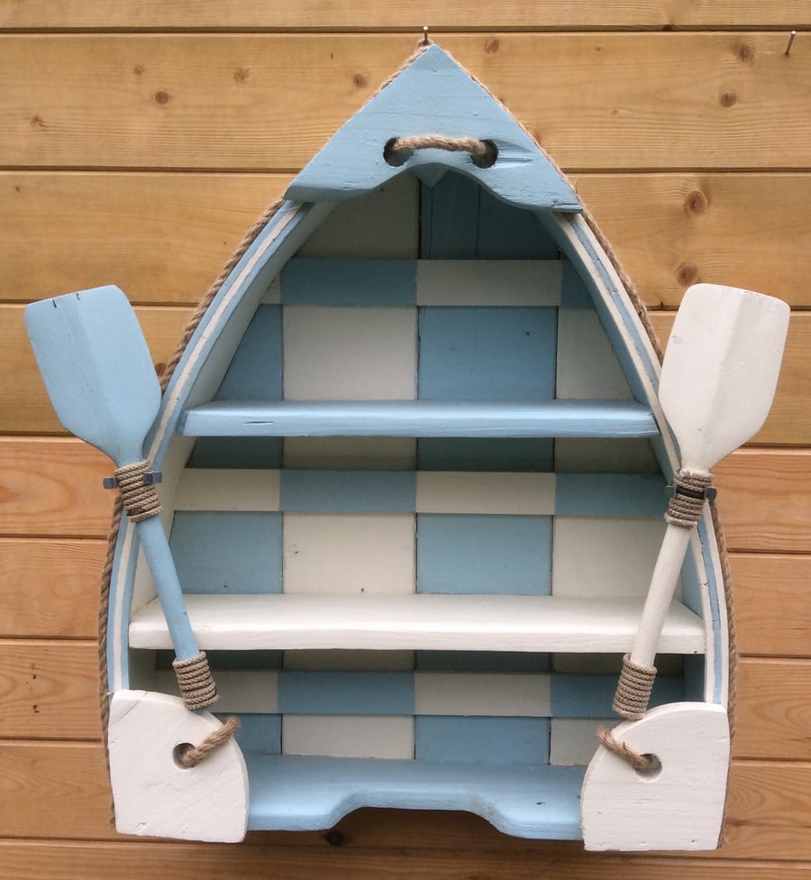 Boat shaped shelving unit.