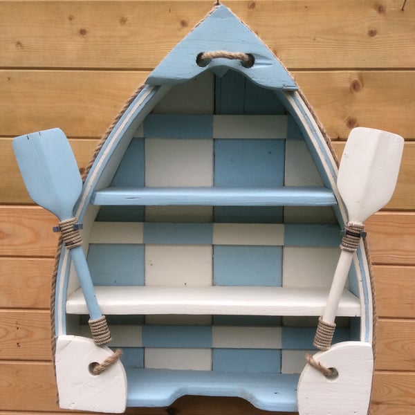 Boat shaped shelving unit.