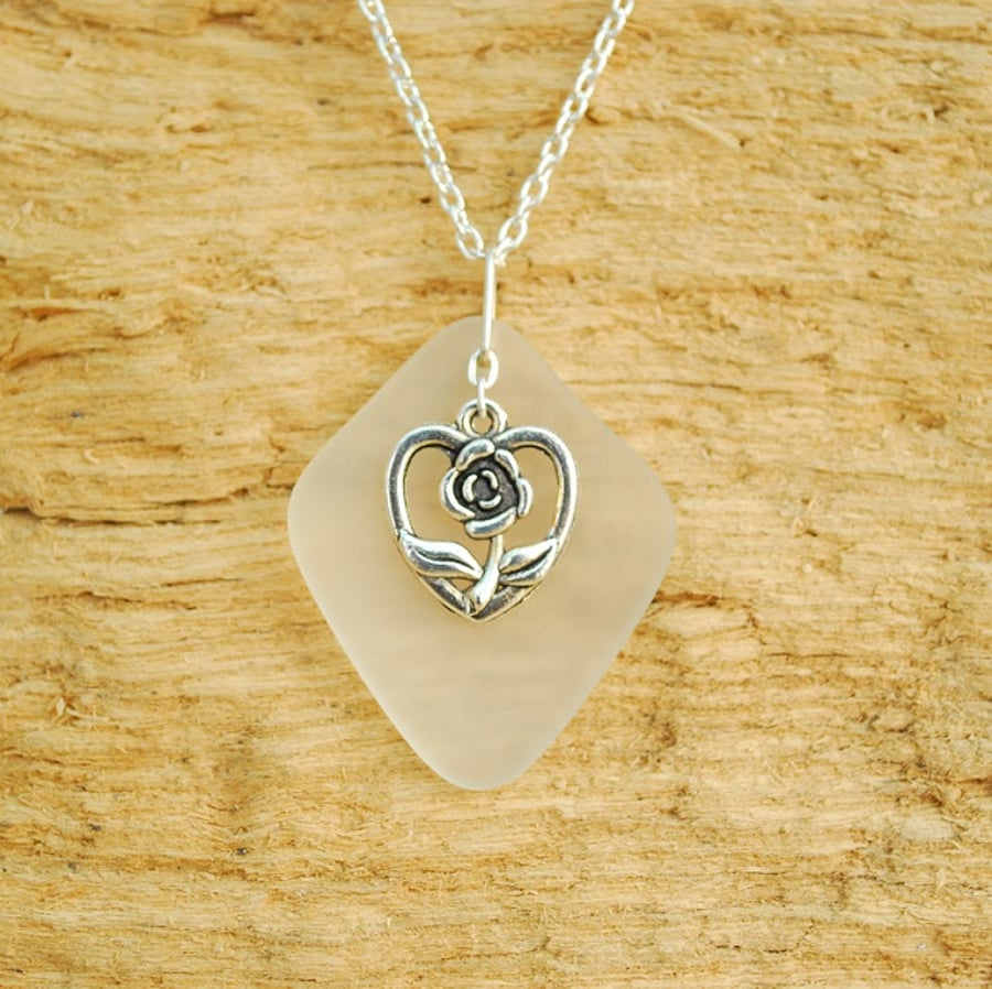 White beach glass pendant with rose in a heart charm
