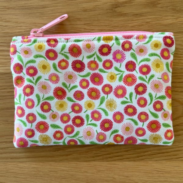 Small zipped fabric coin purse, pouch, in pink floral design.