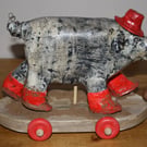 HAND MADE PAPER MACHE RED WELLY PIG WITH HAT ON WHEELS, FOLK ART INSPIRED