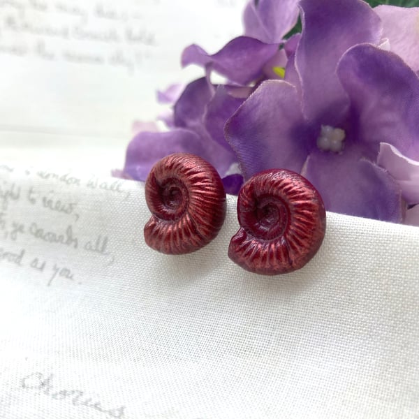 Fossil Ammonite stud earrings in deep ruby red embossing enamel fossil lover