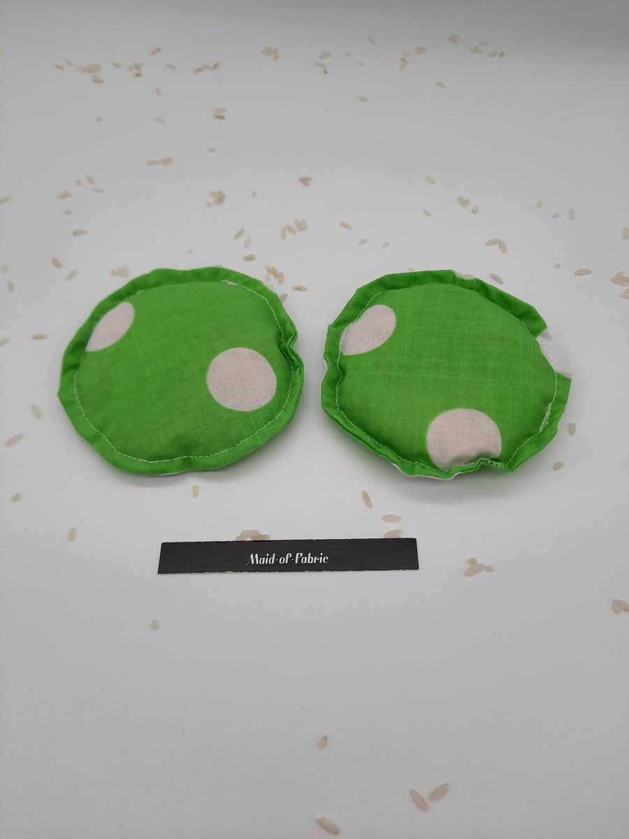 Heat pads - hand warmers, filled in green giant polkadot fabric 