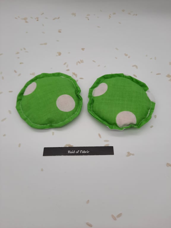 Heat pads - hand warmers, filled in green giant polkadot fabric 