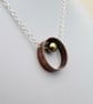 Copper and Silver Ring Pendant with Mobile Pearl Bead - Image 3