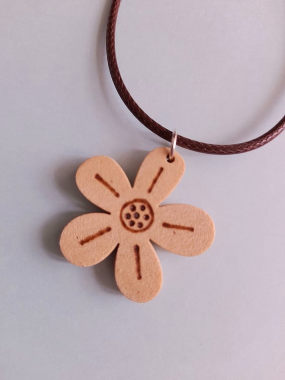 Flower shaped wooden pendant made from oak. Adjustable waxed cord necklace with 