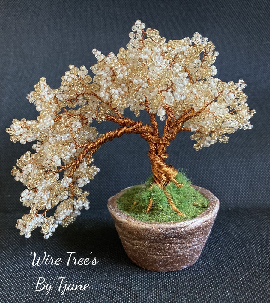 Copper wire tree sculpture with clay pot