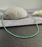 Emerald and 9 carat gold necklace