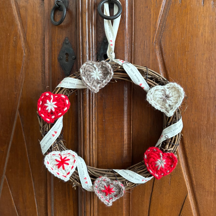 Image of Scandi-style Christmas wreath with crocheted hearts and ribbon