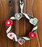 Scandi-style Christmas wreath with crocheted hearts and ribbon - Image 1