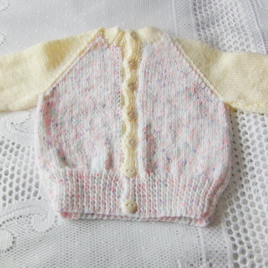 Hand Knitted Round Neck Baby Cardigan in Variegated Pink and White Yarn