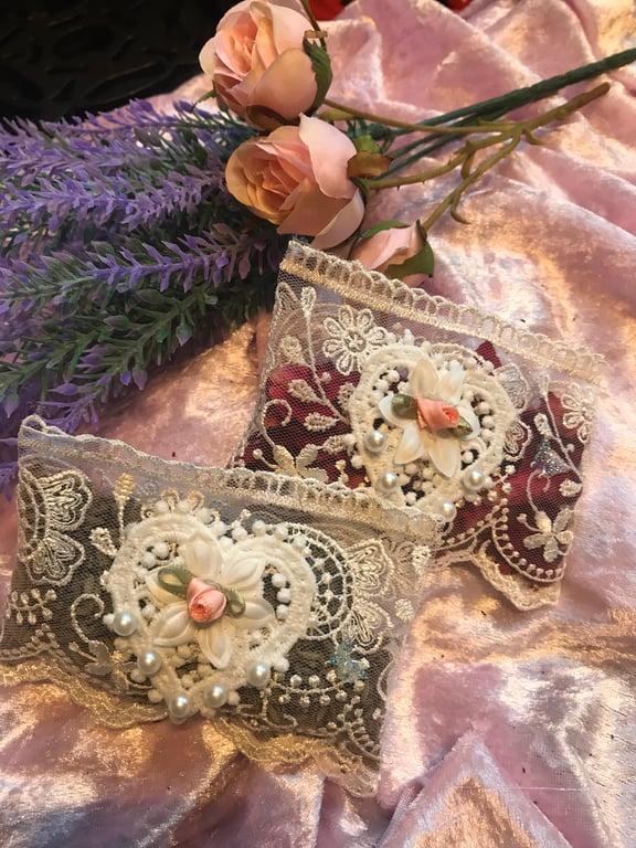 Pair of lace sachets. One each of lavender and rose