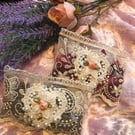 Pair of lace sachets. One each of lavender and rose