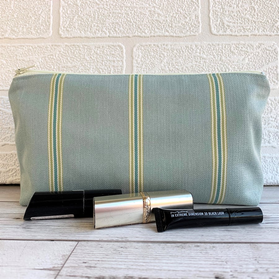 Duck egg blue make up bag with narrow turquoise, lime and white stripes