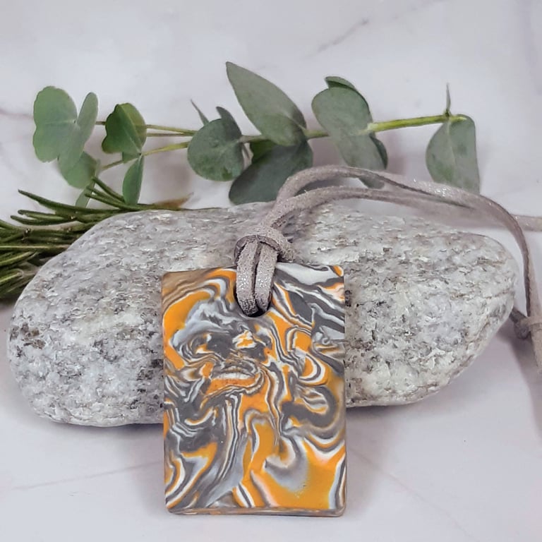 Orange and silver rectangular pendant