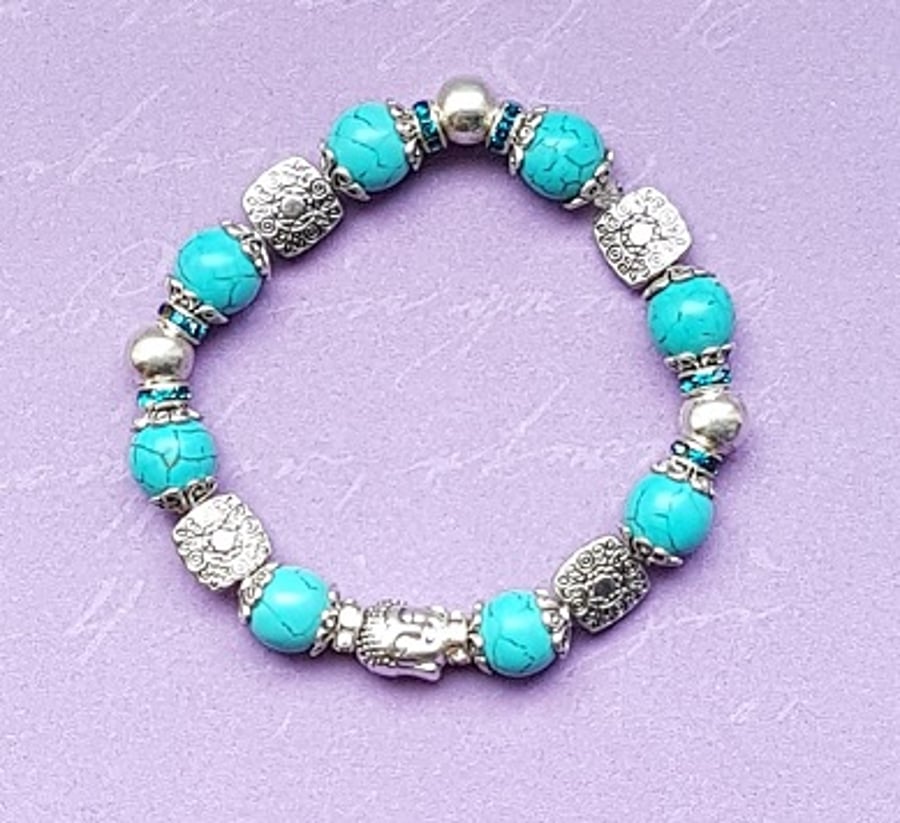 Beautiful Turquoise and fancy bead stretch bracelet with Buddha head.