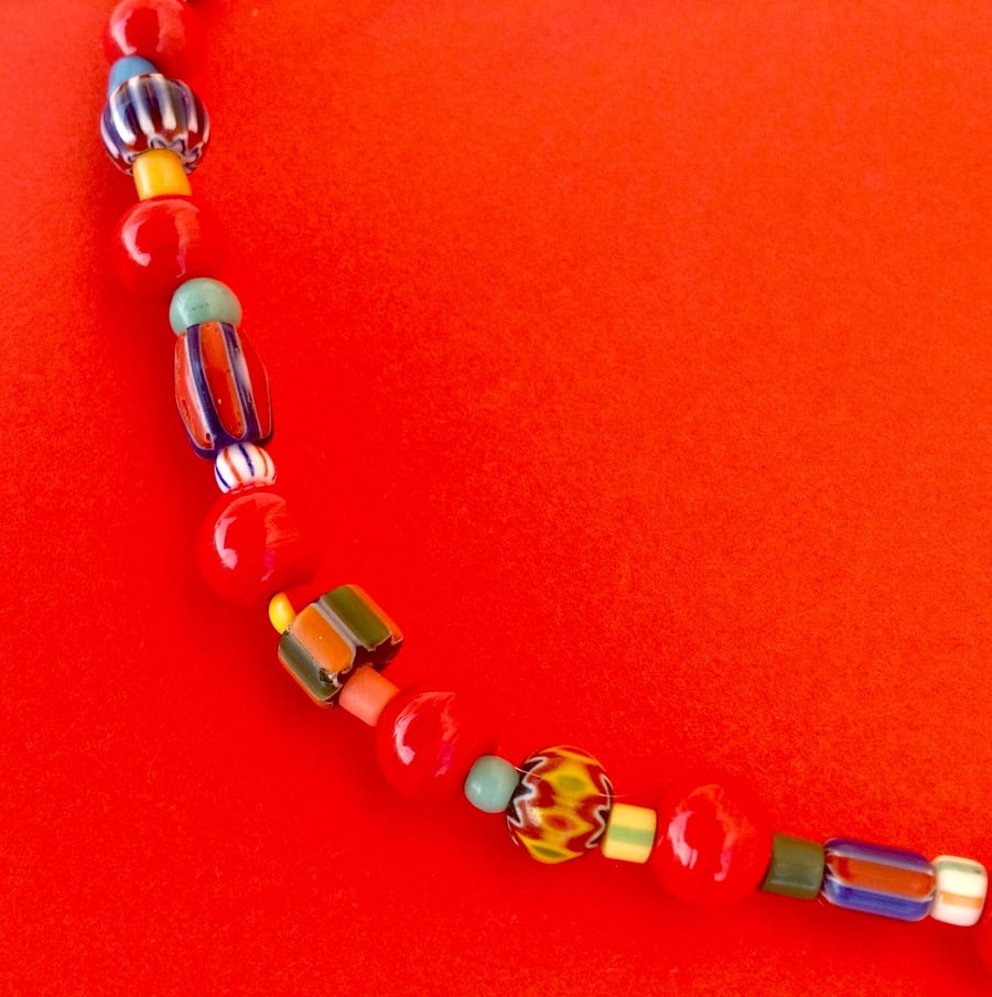Bright bead necklace with red glass beads, Nepalese chevron beads and others