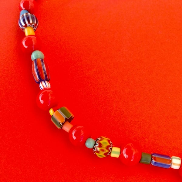 Bright bead necklace with red glass beads, Nepalese chevron beads and others