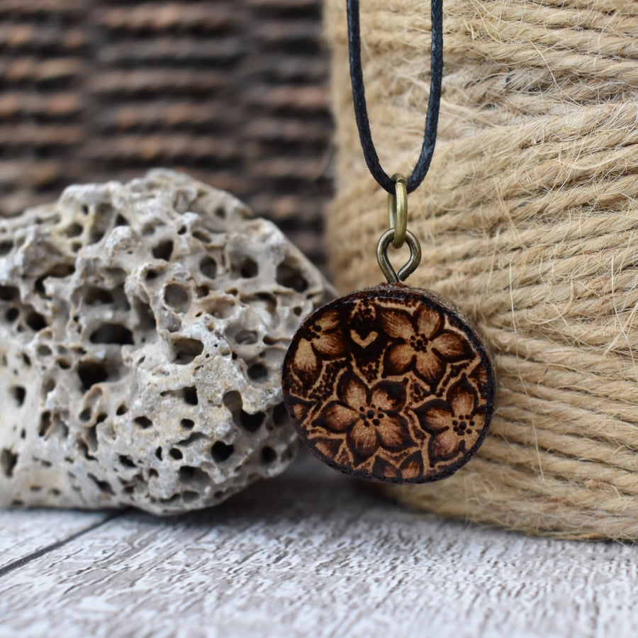 Star flowers and heart pyrography pendant. Rustic branch slice nature necklace.