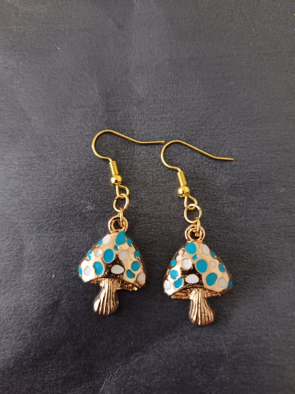 Gold toadstool charm dangle earrings with white and blue spots 