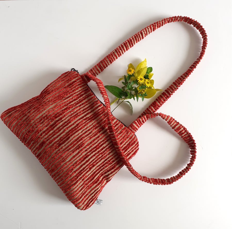 Handbag or shoulder bag in an autumnal striped velour fabric with chunky zip 