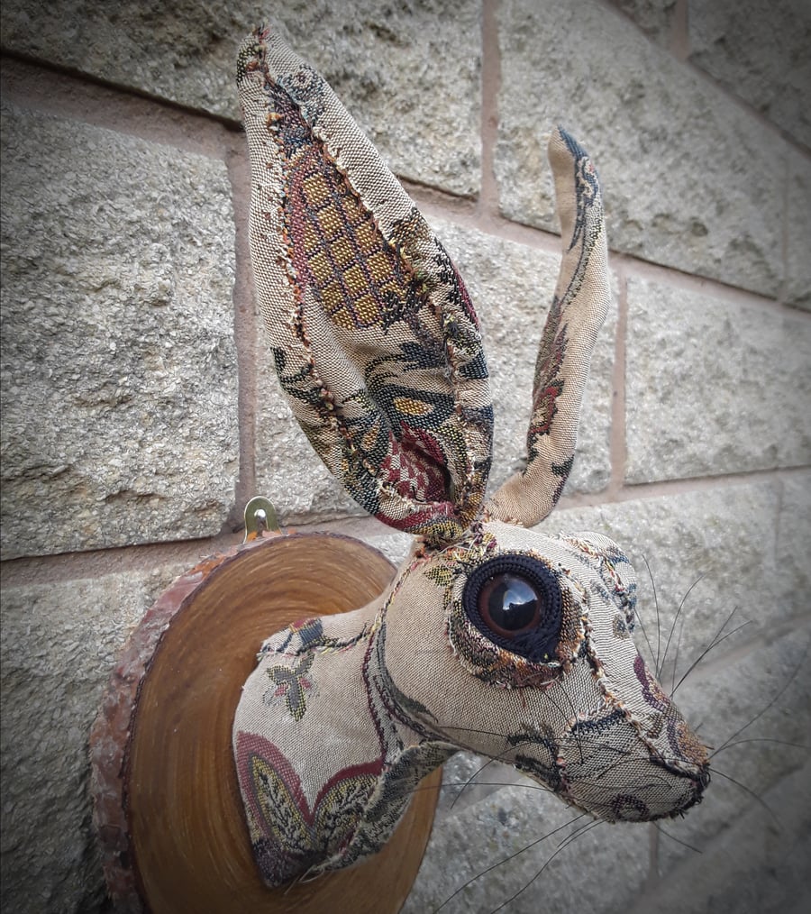 Hare head tapestry faux taxidermy mounted on log slice