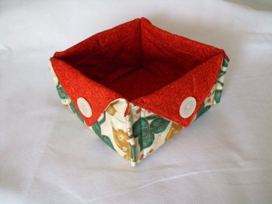 folded fabric storage tub for your bits and bobs, leaf print fabric, rust red
