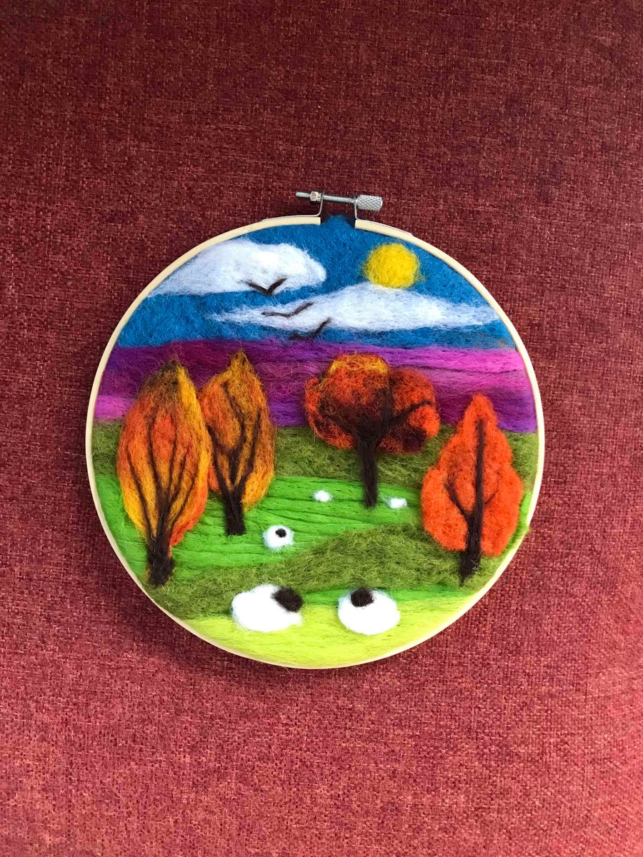 Felted landscape with sheep.