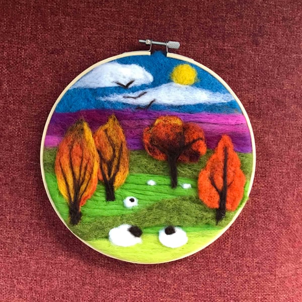 Felted landscape with sheep.
