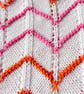 Orange, pink, and white striped baby blanket in cotton mix yarn  - Image 3