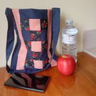 Patchwork bag. Navy blue and peach. Internal pocket.