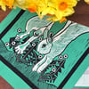 "Leap for Joy" tea towel - rabbit screen print in teal and black inks