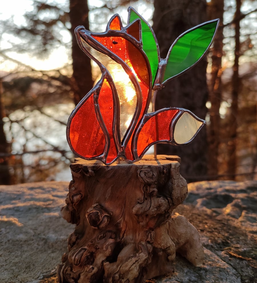 Hand made stained glass fox on a light up tree stump