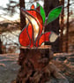 Hand made stained glass fox on a light up tree stump