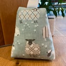 Cotton fabric doorstop in duck egg blue, fun sheep print, filled with pebbles