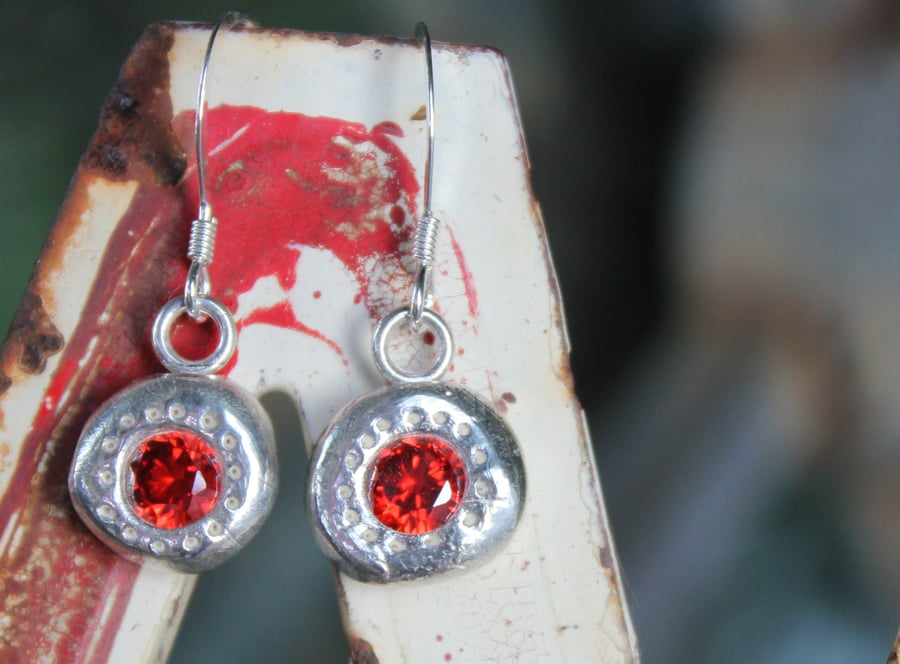 solid silver earrings set with large gemstones