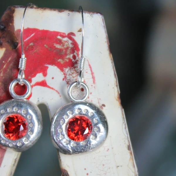 solid silver earrings set with large gemstones