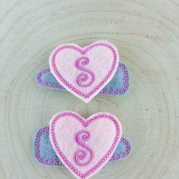 Kids Hair Clips With The Letter S Embroidered In Pink In A Heart