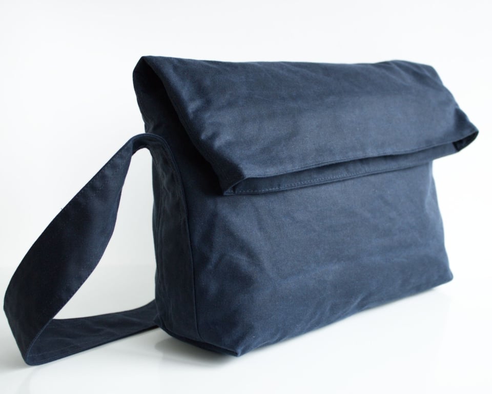 Minimal fold top bag in navy waxed canvas by Minus