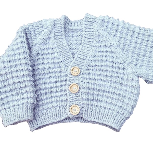 Hand knitted baby cardigan in light grey textured pattern 